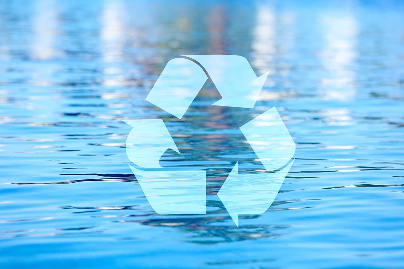 Recycyling symbol over water background