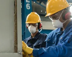 manufacturing workers wearing masks