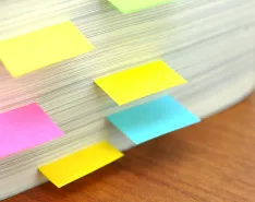pile of paper with post-it notes