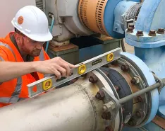 Engineer measuring pump